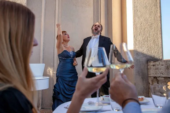 An open-air opera concert with aperitivo on a terrace in the centre of Rome, sold on Viator, a Rome opera concert, opera houses in Italy